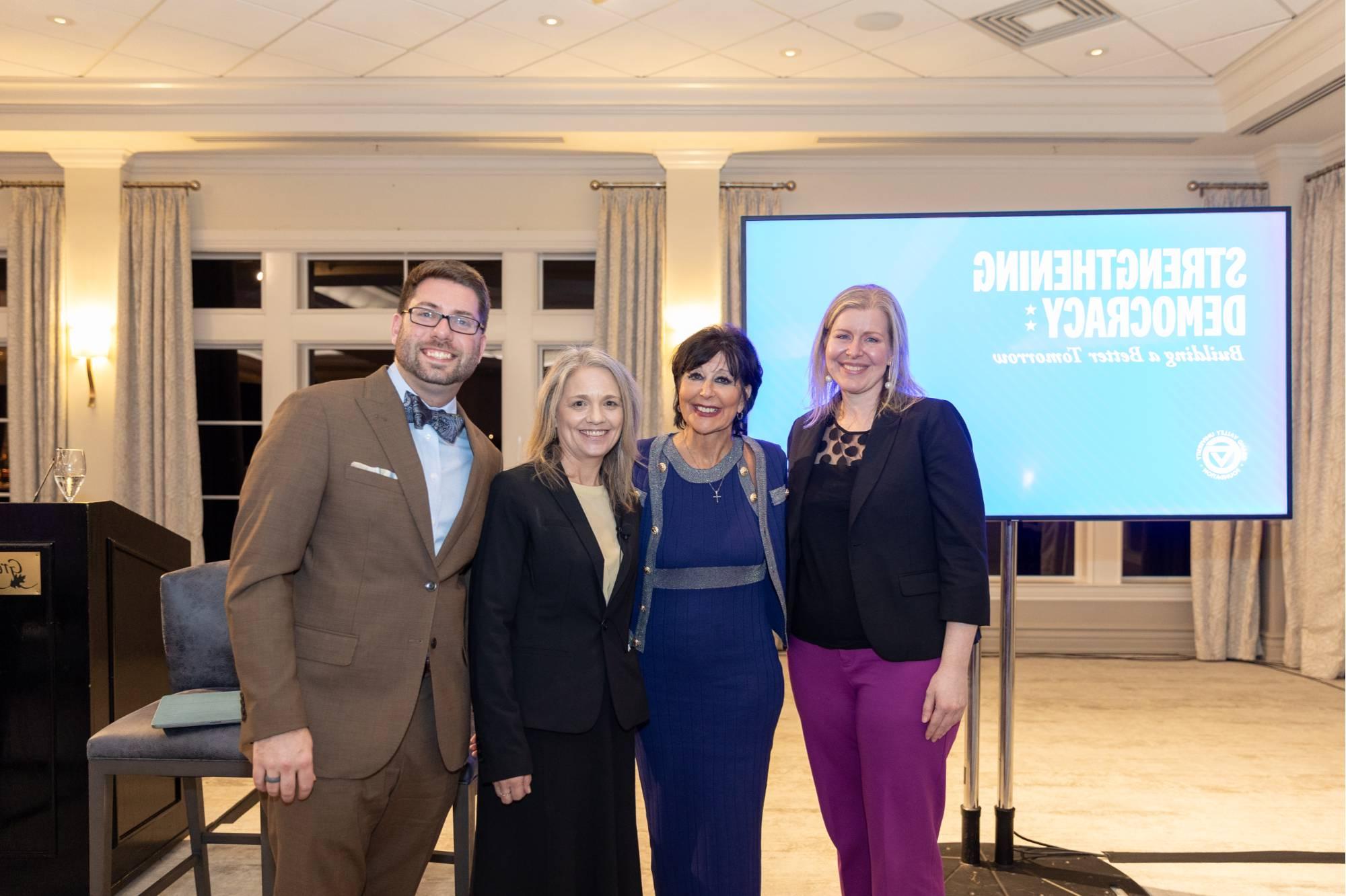 President Mantella posing with panelists Nicole Hemmer, Lisa Perhamus, and Kyle Kooyers